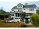A backyard features a patio with an outdoor dining area and a fire pit at 2961 Yachtsman Dr, Mount Pleasant, SC 29466