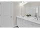 Bright bathroom features white cabinets, a double sink vanity, chrome faucets and greenery at 2961 Yachtsman Dr, Mount Pleasant, SC 29466