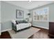Inviting bedroom features natural light, light blue walls and a day bed with a white rug at 2961 Yachtsman Dr, Mount Pleasant, SC 29466