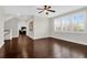 Bonus room with dark hardwood floors, a ceiling fan, bright light from windows and view to next room at 2961 Yachtsman Dr, Mount Pleasant, SC 29466