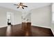 Bonus room with dark wood flooring, white walls, a ceiling fan, and an entrance to another room at 2961 Yachtsman Dr, Mount Pleasant, SC 29466