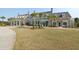 Elegant clubhouse with multiple entrances surrounded by palm trees and manicured landscaping at 2961 Yachtsman Dr, Mount Pleasant, SC 29466