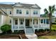 Charming home featuring a classic front porch with white columns and a beautifully landscaped front yard at 2961 Yachtsman Dr, Mount Pleasant, SC 29466