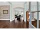 Inviting foyer with dark hardwood floors, decorative wall accents, and an arched entryway to the living area at 2961 Yachtsman Dr, Mount Pleasant, SC 29466