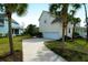 View of the side of the home showing the driveway and garage at 2961 Yachtsman Dr, Mount Pleasant, SC 29466