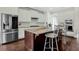 Bright kitchen featuring stainless steel appliances, white cabinets, a center island with seating, and granite countertops at 2961 Yachtsman Dr, Mount Pleasant, SC 29466