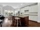 Spacious kitchen with a large island, granite countertops, white cabinetry, and a connected dining area at 2961 Yachtsman Dr, Mount Pleasant, SC 29466