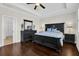 Spacious main bedroom with dark wood floors, black furniture and tray ceilings at 2961 Yachtsman Dr, Mount Pleasant, SC 29466