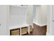 Bright mudroom featuring a built-in bench with storage baskets and an arched doorway leading to another room at 2961 Yachtsman Dr, Mount Pleasant, SC 29466