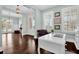 Comfortable office space featuring a white desk, shuttered windows, and access to the outdoor balcony at 2961 Yachtsman Dr, Mount Pleasant, SC 29466