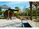 Inviting outdoor patio area, complete with comfortable seating, a pergola, and a cozy fire pit at 2961 Yachtsman Dr, Mount Pleasant, SC 29466
