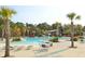 Resort-style pool area with a waterslide, palm trees, lounge chairs, and outdoor dining space at 2961 Yachtsman Dr, Mount Pleasant, SC 29466