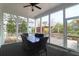 Covered porch showcases a dark wood floor with a large table and seating surrounded by white columns and screens at 2961 Yachtsman Dr, Mount Pleasant, SC 29466