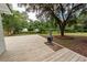 Spacious wooden deck with a fire pit and a large tree in the backyard at 3166 Edenvale Rd, Johns Island, SC 29455