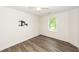 Neutral bedroom with hardwood floors, a bright window, and a ceiling fan at 3166 Edenvale Rd, Johns Island, SC 29455