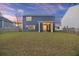 The beautiful backyard featuring a screened-in porch, perfect for relaxing and entertaining at 3215 Safe Harbor Way, Charleston, SC 29414