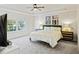 Bright bedroom with tray ceilings, neutral walls, and large window for natural light at 3215 Safe Harbor Way, Charleston, SC 29414