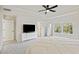 Spacious bedroom with carpeted floors and modern ceiling fan and large windows at 3215 Safe Harbor Way, Charleston, SC 29414