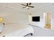Neutral bedroom with carpeted floors and tray ceilings plus an open door to another room at 3215 Safe Harbor Way, Charleston, SC 29414