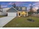 Charming two-story home with a well-manicured lawn and inviting curb appeal at 3215 Safe Harbor Way, Charleston, SC 29414