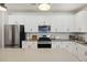 Bright kitchen featuring white cabinets, stainless steel appliances, and center island at 3215 Safe Harbor Way, Charleston, SC 29414