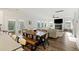 An open layout presents a fireplace and a large living room area with natural light at 3215 Safe Harbor Way, Charleston, SC 29414