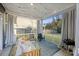 Cozy screened-in porch with comfortable seating, string lights, and backyard views at 3215 Safe Harbor Way, Charleston, SC 29414