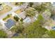 A beautiful aerial view of the property and pool surrounded by mature trees at 3308 Island Estates Dr, Johns Island, SC 29455