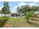 Spacious backyard featuring a sparkling pool, patio area, privacy fence, and lush greenery at 3308 Island Estates Dr, Johns Island, SC 29455