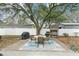 Outdoor patio area with dining table, grill and privacy fence offers space for entertaining at 3308 Island Estates Dr, Johns Island, SC 29455