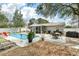 Spacious backyard featuring a pool, patio seating and manicured landscaping at 3308 Island Estates Dr, Johns Island, SC 29455