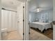 Light-filled bedroom with ensuite bath features a ceiling fan and neutral decor at 3308 Island Estates Dr, Johns Island, SC 29455