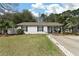 Charming single-story home with a well-maintained lawn and a private driveway at 3308 Island Estates Dr, Johns Island, SC 29455