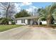 A charming single-story home with a well-manicured lawn and a welcoming entrance at 3308 Island Estates Dr, Johns Island, SC 29455