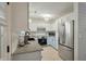 Modern kitchen featuring stainless steel appliances, granite countertops, and crisp white cabinetry at 3308 Island Estates Dr, Johns Island, SC 29455