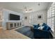 Cozy living space with a comfortable blue sectional, shiplap accent wall, and stylish furniture at 3308 Island Estates Dr, Johns Island, SC 29455