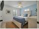 This bright primary suite features a ceiling fan and calming blue accents at 3308 Island Estates Dr, Johns Island, SC 29455