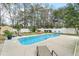 Relaxing pool area with lounge chairs and beautiful landscaping at 3308 Island Estates Dr, Johns Island, SC 29455