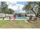 Private backyard oasis with pool, screened porch, and outdoor seating at 3308 Island Estates Dr, Johns Island, SC 29455