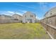 Large backyard with a grassy lawn, wooden fence, and patio with pergola at 343 Iveson Rd, Summerville, SC 29486