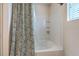 Clean bathroom bathtub with a shower curtain and white tiled walls at 343 Iveson Rd, Summerville, SC 29486