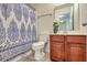 Cozy bathroom showcasing a toilet, wood vanity, and a patterned shower curtain at 343 Iveson Rd, Summerville, SC 29486