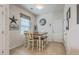Cozy breakfast nook with a modern light fixture and a square wood table and bench seating at 343 Iveson Rd, Summerville, SC 29486
