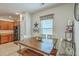 Inviting eat-in kitchen with a wooden table, bench seating, and adjacent kitchen with stainless steel appliances at 343 Iveson Rd, Summerville, SC 29486