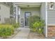 Welcoming front porch with decorative accents and well-maintained landscaping, creating a charming entrance at 343 Iveson Rd, Summerville, SC 29486