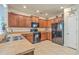 Well-equipped kitchen featuring dark cabinetry, black appliances, and durable countertops, perfect for cooking at 343 Iveson Rd, Summerville, SC 29486