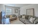Comfortable living room with two couches, a TV, and decorative wall art at 343 Iveson Rd, Summerville, SC 29486