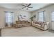 Bright living room featuring comfortable sofas, neutral carpet, and ample natural light at 343 Iveson Rd, Summerville, SC 29486