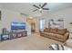 Comfortable living room with a sofa, television, and staircase, creating a relaxing atmosphere at 343 Iveson Rd, Summerville, SC 29486