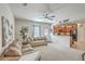 Cozy living room with plush sofas, neutral carpet, and an open layout connected to the kitchen at 343 Iveson Rd, Summerville, SC 29486